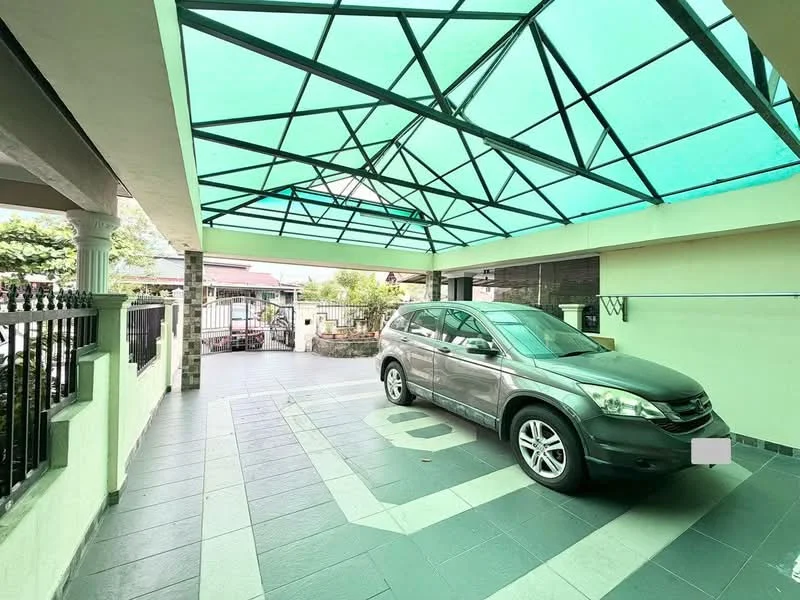 Exterior type: car porch; features: covered car porch with translucent roof, grey tiled flooring, parking space for one vehicle, surrounding fence, manicured landscaping visible in background, access gate, open layout; style: modern.