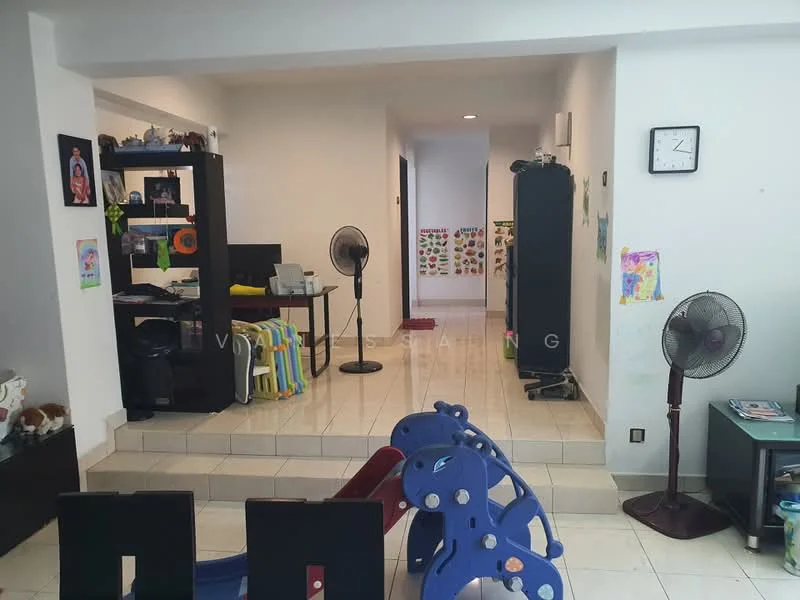 Living features: white painted walls, tile flooring, ceiling fan, wall-mounted clock, open shelving unit, computer desk, children's play equipment, decorative artwork on walls, two standing fans, seating area with chairs, small side table.