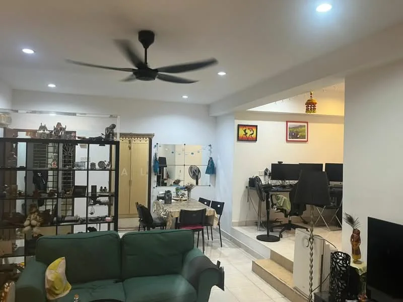 Living features: green fabric sofa, 5-blade ceiling fan with light, recessed LED downlights, tile flooring, decorative wall art, open shelving unit with decorative items, dining table with chairs, workstation with computer monitors, mirror on wall, neutral painted walls; style: modern.