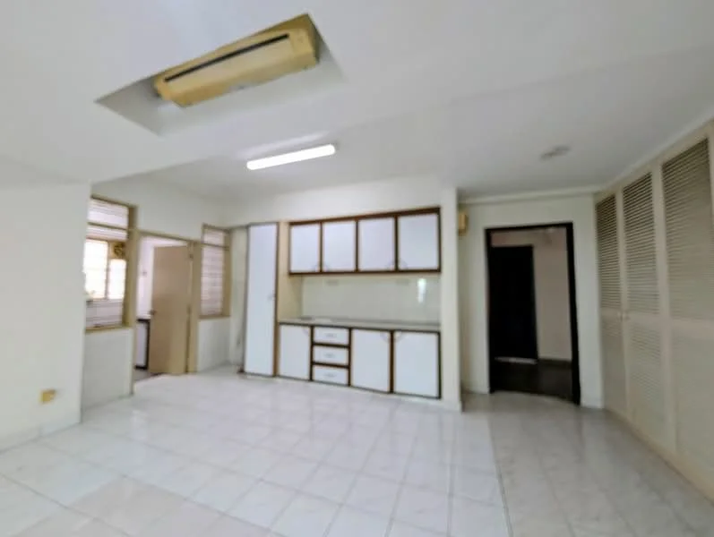 Room features: white painted walls, white tiled flooring, ceiling with recessed lighting, built-in cabinetry with white doors, kitchen countertop, air conditioning unit, doorway leading to another room, sliding louvered doors, window with grid pattern.