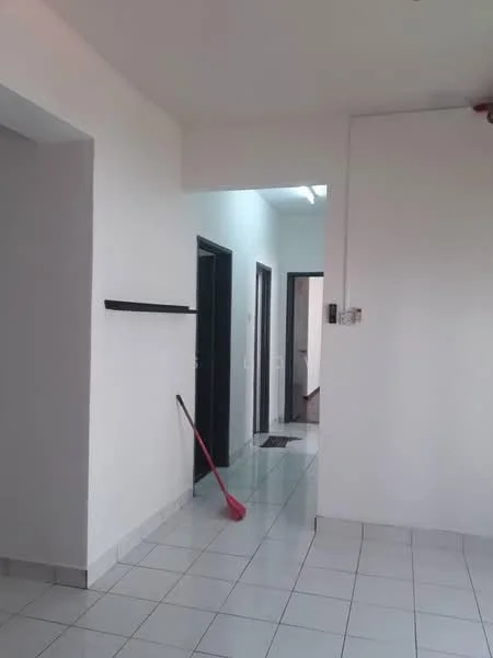 Room features: white painted walls, tile flooring, ceiling light fixture, door frames in black, shelf mounted on wall, red cleaning tool, doorway leading to other rooms.
