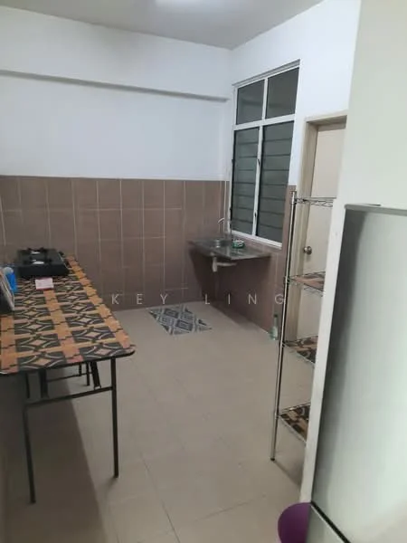 Kitchen features: brown tiled walls, white painted walls, ceramic tile flooring, single-bowl stainless-steel sink, chrome pull-down faucet, kitchen countertop, metal shelving unit, dining table with patterned top, window with metal frame, door leading to hallway.