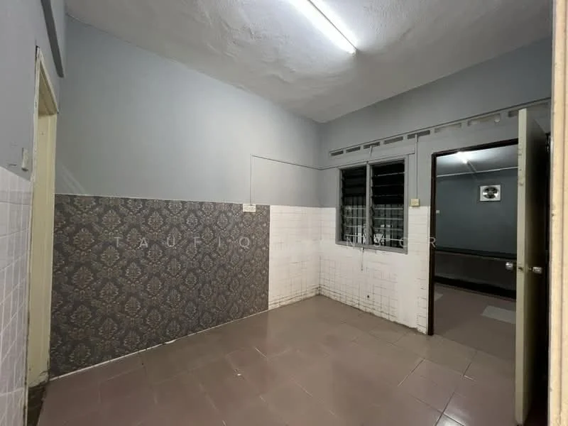 Room features: grey painted walls, white tiled walls, decorative wallpaper with floral pattern, pink ceramic tile flooring, fluorescent ceiling light, window with metal grille, door with handle, corner wall.