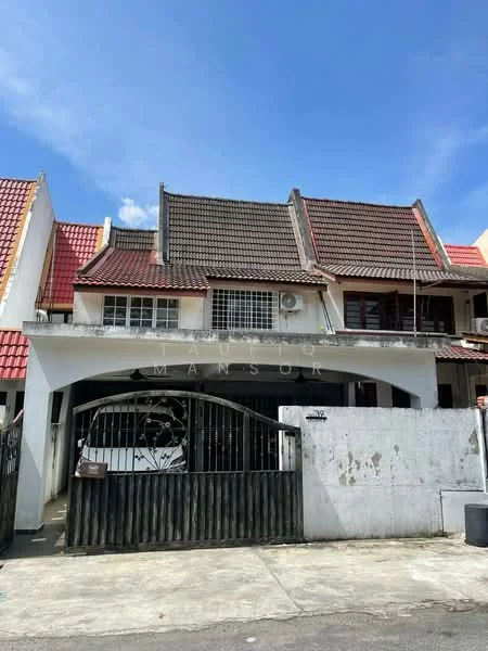 Exterior type: linked terrace house; features: red tiled roof, white painted facade, black wooden gate, front porch, two-storey structure, air conditioning unit visible, decorative wrought iron details, surrounded by neighboring houses; style: traditional.
