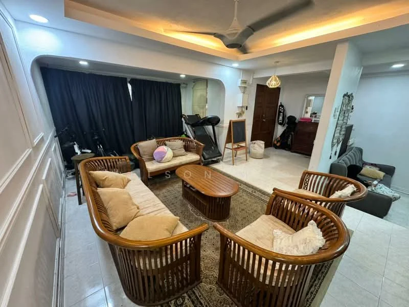 Living features: woven rattan seating, beige cushions, round wooden coffee table, area rug with intricate pattern, ceiling fan with light, wall-mounted mirror, dark curtains, light-colored tiled flooring, decorative wall paneling, exercise equipment in corner, side table, dark sofa; style: contemporary.