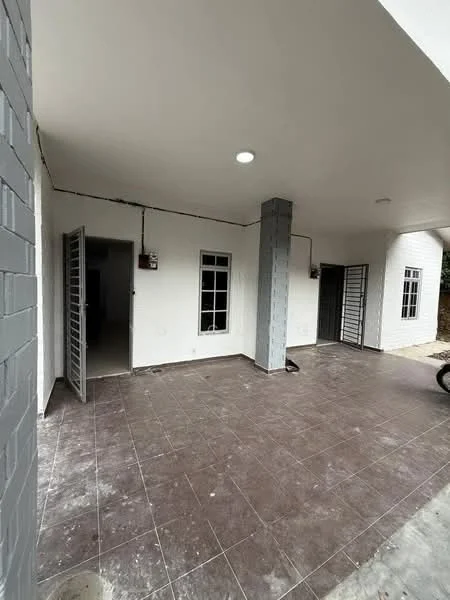 Room features: white painted walls, grey tiled flooring, recessed ceiling lights, metal security grills on doors, two doors leading outside, one column in the center, no visible furniture or decor; style: modern.