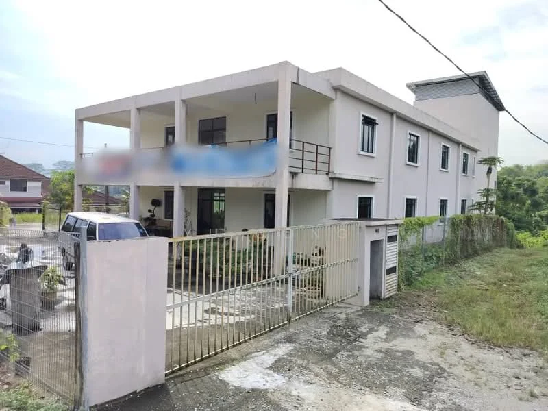 Exterior type: low-rise apartment block; features: white painted facade, flat roof, two-storey building, gated entrance, manicured lawn, surrounded by greenery, parking area, balconies on upper floor, concrete pathway, fence around property; style: modern.