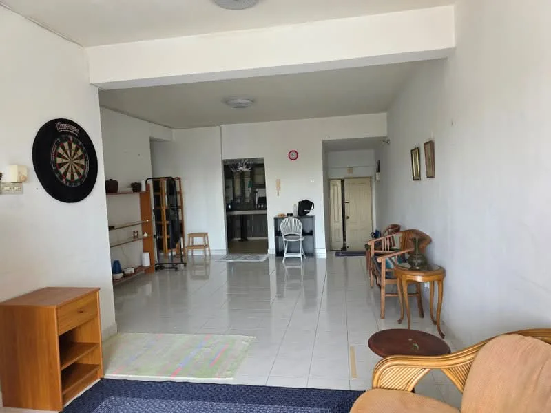 Living features: white painted walls, glossy tile flooring, ceiling light fixture, dartboard on wall, wooden side table, 2 wooden chairs, sofa, area rug, open layout, doorway leading to another room, window with natural light; style: minimalist.