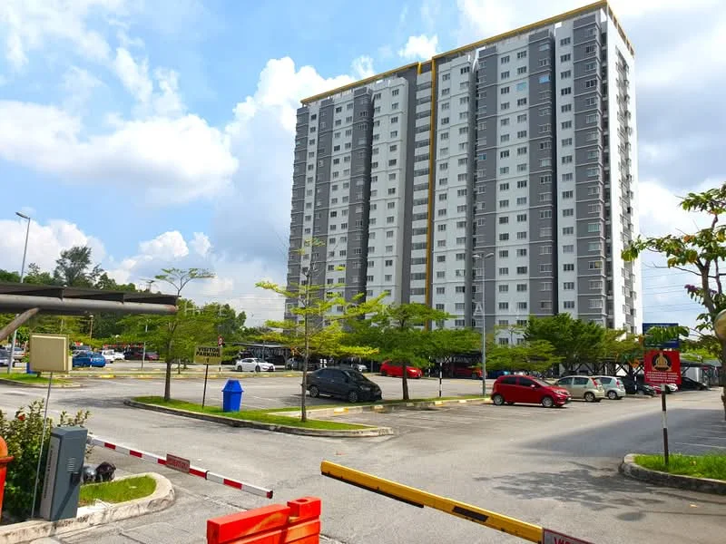 Exterior type: high-rise condominium; features: grey and white facade, approximately 10-storey high-rise, surrounded by parking lot, landscaped greenery, multiple car parking spaces, entrance gate with barrier, street lighting, paved driveway; style: modern.