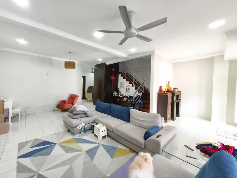 Living features: L-shape sectional sofa in grey, 3-blade ceiling fan, white painted walls, tile flooring, area rug with geometric pattern, wall-mounted TV, coffee table, decorative items on shelves, staircase in background, red accent chair, open layout, natural light from windows; style: modern.