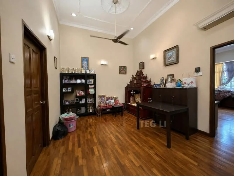 Room features: wooden flooring, cream painted walls, tray ceiling, ceiling fan, wall-mounted lighting, dark wooden door, dark wooden sideboard, black shelving unit, decorative items on shelves, framed photographs, window with sheer curtains; style: traditional.