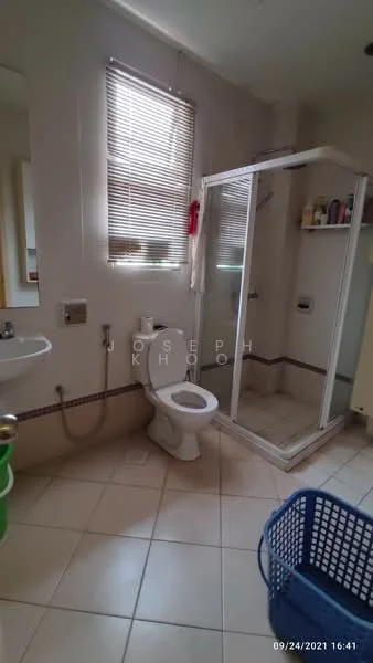 Bathroom features: white tiled walls, cream tiled flooring, single-sink vanity with mirror, toilet, walk-in shower with glass enclosure, shower head, towel rack, window with blinds, basket for laundry.