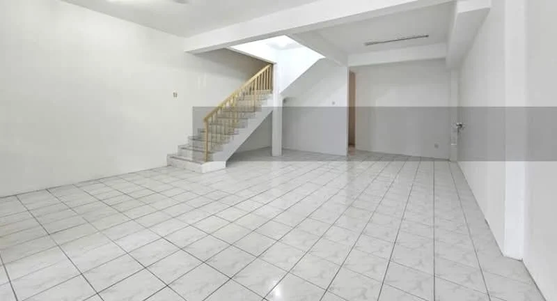 Room features: white painted walls, white ceiling, marble tile flooring, staircase with wooden railing, large open space, natural light from windows, no visible furniture, neutral color scheme; style: modern.