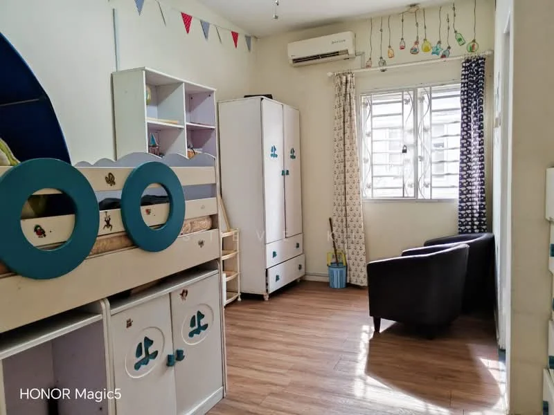 Bedroom features: bunk bed with blue accents, white wardrobe with blue handles, wooden flooring, air conditioning unit on wall, window with sheer curtains, black armchair, decorative bunting on wall, wall-mounted light fixture; style: modern.