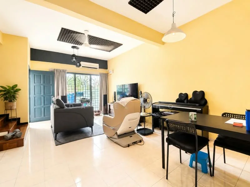 Living features: yellow painted walls, white ceiling, tile flooring, 5-blade ceiling fan, recessed downlights, large window with grille, sofa in grey fabric, TV console, wall-mounted TV, decorative plants, massage chair, dining table with black chairs, blue stool, air conditioning unit; style: modern; view: garden.