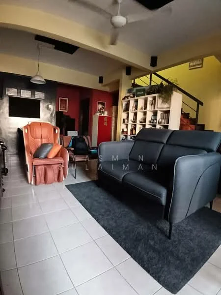 Living features: grey leather sofa, orange recliner chair, black area rug, white tiled flooring, ceiling fan, wall-mounted artwork, decorative plants on shelf, black accent wall, light yellow wall, staircase in background; style: modern.