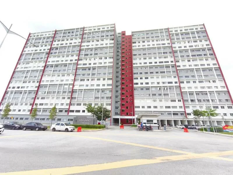 Exterior type: mid-rise condominium; features: red and white facade, multiple floors, balconies on each floor, large windows, covered entrance, parking area in front, surrounding greenery, street access, signage at entrance; style: modern.