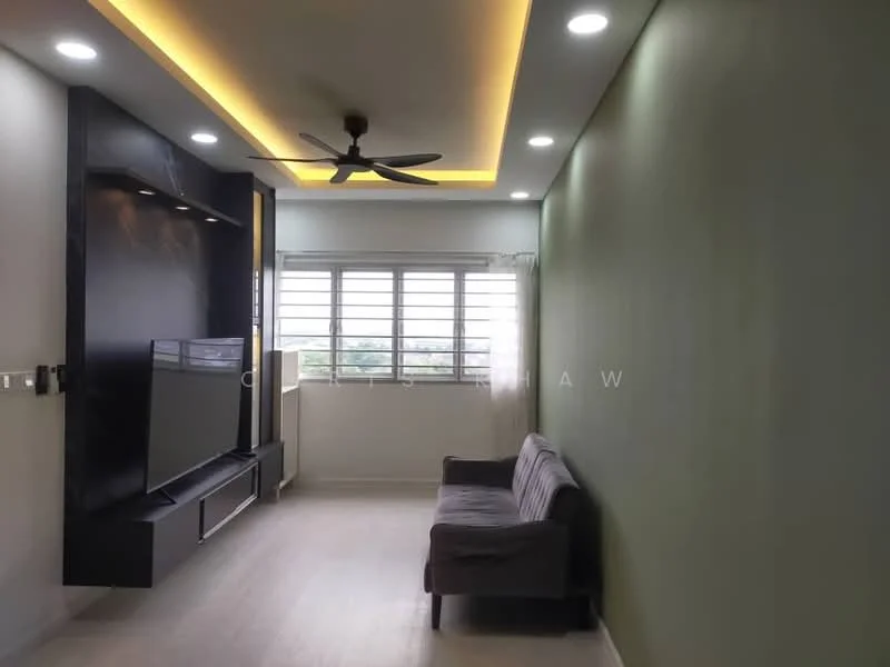 Living features: light green painted walls, white ceiling with recessed lighting, 5-blade ceiling fan with light, wooden flooring, wall-mounted TV, black entertainment unit, sofa in grey fabric, large windows with sheer curtains; style: modern; view: city.