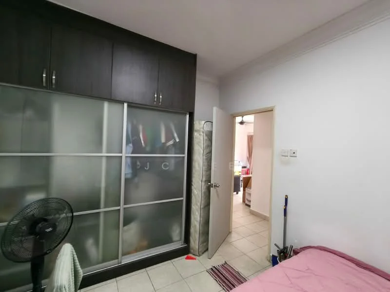 Bedroom features: built-in wardrobe with sliding glass doors, queen-size bed, wall-mounted fan, tile flooring, white painted walls, door leading to hallway, decorative rug.