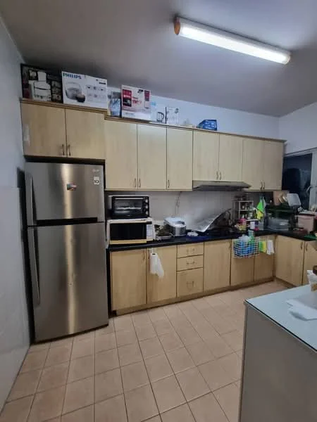 Kitchen features: stainless-steel fridge, built-in microwave, freestanding oven, black countertop, light wood cabinetry, tile backsplash, ceramic tile flooring, under-cabinet lighting, window above sink, kitchen sink, dish rack, various kitchen appliances on countertop; style: modern.