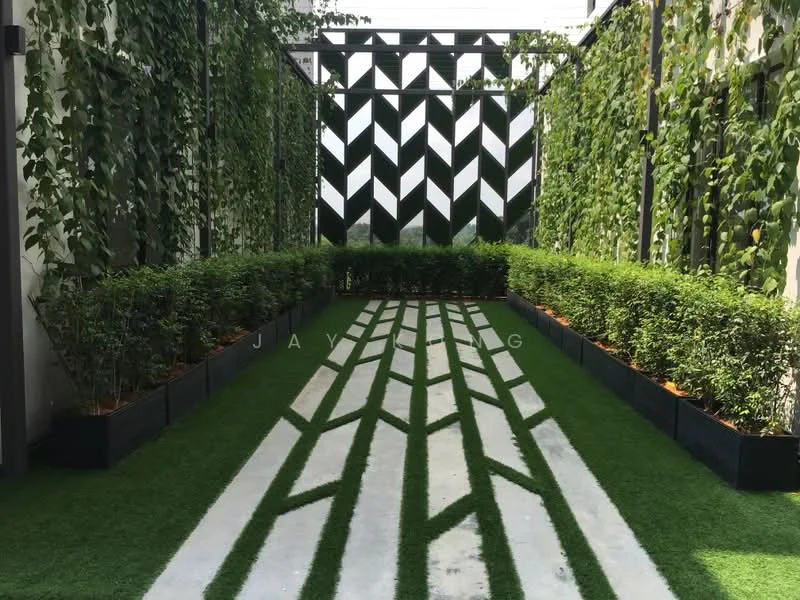 Exterior type: landscape garden; features: manicured lawn, decorative hedges, paved pathway with geometric pattern, vertical garden wall, planters with greenery, artificial grass, fence with modern design; style: modern.