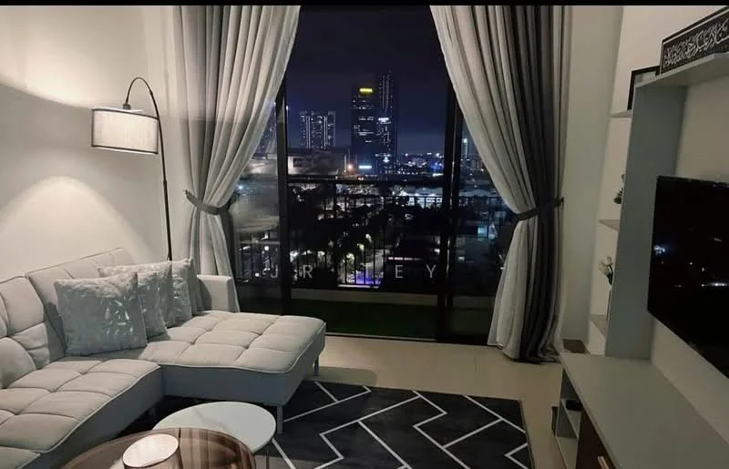 Living features: L-shape sectional sofa in light grey, decorative throw pillows, coffee table with round top, area rug with geometric pattern, floor-to-ceiling windows, curtains in light grey, wall-mounted TV, TV console with storage, wall decor with framed artwork, recessed downlights; style: modern; view: city.