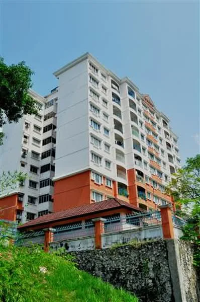 Exterior type: mid-rise condominium; features: white painted facade, red accent sections, balconies with sliding glass doors, multiple windows, manicured lawn, surrounded by greenery, gated entry with fence, covered parking area; style: modern.
