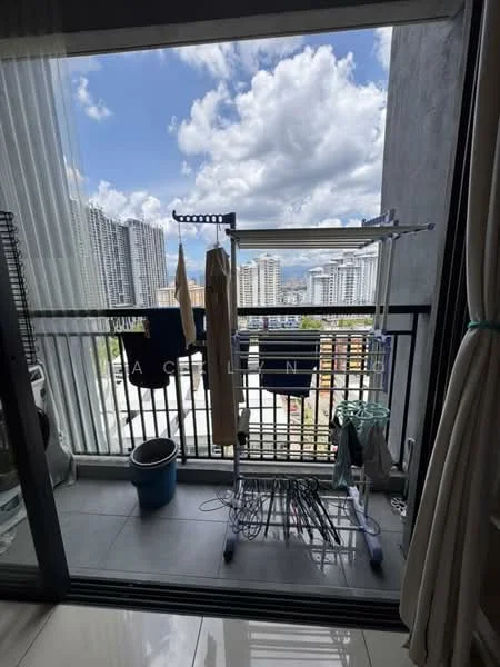 Room features: balcony with glass railing, city skyline view, grey tiled flooring, clothes drying rack, plastic laundry basket, laundry hanging, high-rise buildings in background, cloudy sky; style: modern; view: city.
