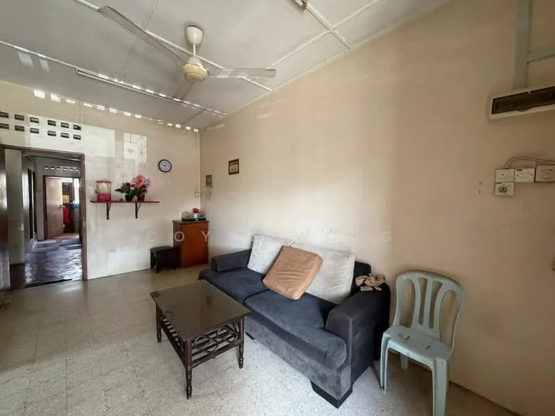 Living features: 3-seater fabric sofa in dark grey, wooden coffee table, ceiling fan, wall-mounted air conditioning unit, light-colored walls, tile flooring, decorative wall shelf, clock on the wall, single plastic chair, window with natural light.