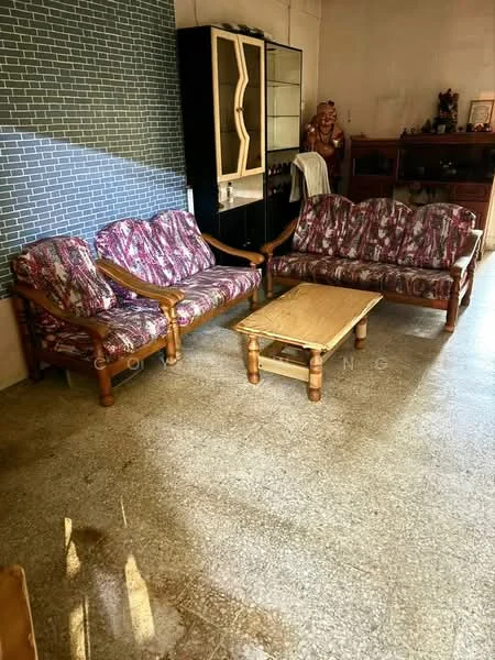 Living features: 3-seater fabric sofa with floral pattern, 2-seater fabric sofa with floral pattern, wooden coffee table, textured wall with grey tiles, light-colored flooring, wooden cabinet, decorative items on shelves; style: traditional.