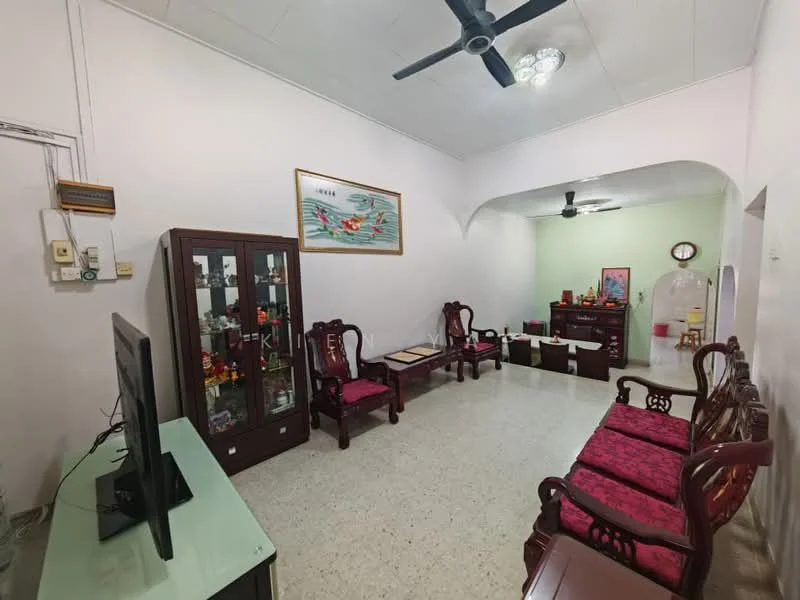 Living features: white painted walls, polished floor tiles, 5-blade ceiling fan with light, wall-mounted TV, wooden coffee table, 2-seater wooden sofa with red upholstery, 3-seater wooden sofa with red upholstery, display cabinet with glass doors, decorative artwork on wall, green accent wall, sideboard with storage; style: traditional.