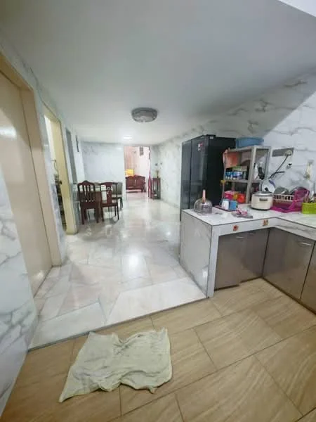 Kitchen features: marble tile flooring, white painted walls, ceiling light fixture, stainless-steel kitchen cabinets, kitchen island with countertop, double-bowl stainless-steel sink, chrome pull-down faucet, built-in refrigerator, open shelving, wall-mounted cabinets; style: modern. Dining features: wood dining table, 4 dining chairs, white walls, ceiling light fixture; style: modern.