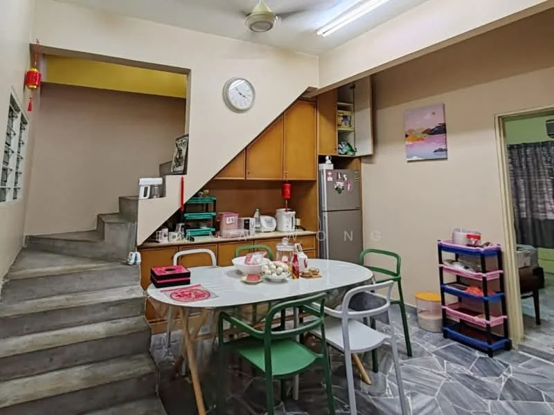 Kitchen features: grey marble tile flooring, cream painted walls, wood cabinetry, white countertop, stainless-steel sink, built-in oven, microwave, kettle, toaster, dining table with chairs, wall clock, open shelving, staircase leading to upper level; style: modern.