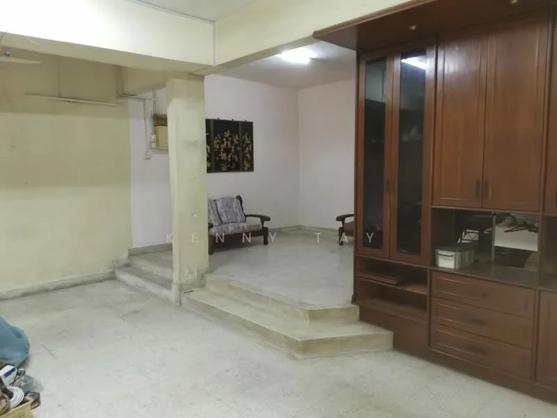 Room features: light-colored tiled flooring, plain white walls, wooden cabinetry, built-in storage unit, two armchairs, step-up area, ceiling lights, open layout; style: minimalist.