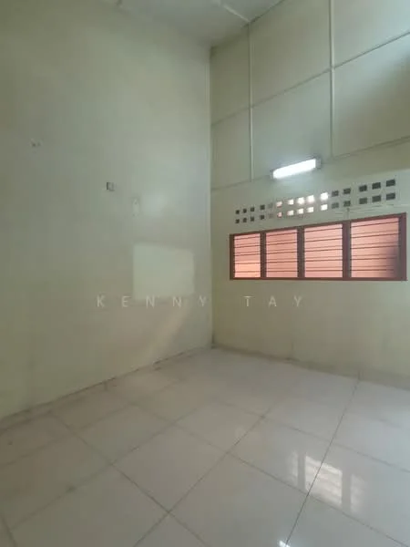 Room features: white painted walls, glossy tile flooring, single fluorescent light fixture, small window with red frame, grilled window security bars, no visible furniture or decor.
