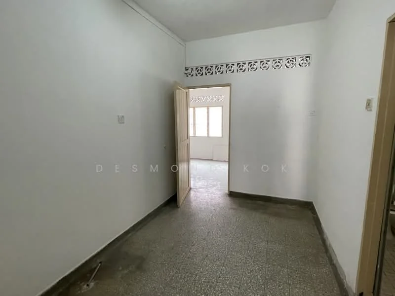 Room features: white painted walls, grey tiled flooring, window with sheer curtains, door leading to another room, decorative wall grille.