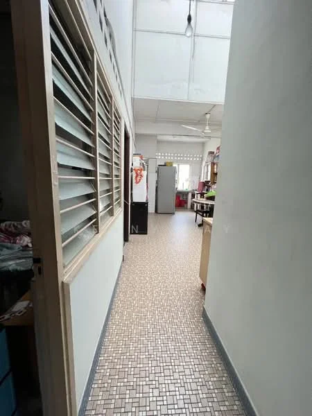 Room features: tiled flooring with mosaic pattern, white painted walls, sliding windows with horizontal slats, ceiling fan, refrigerator, open shelving, wooden cabinets, natural light from windows.