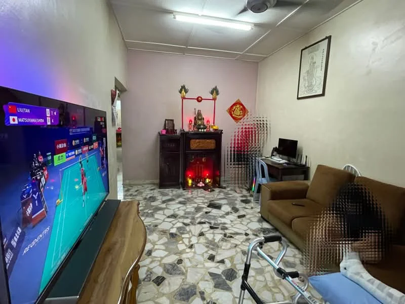 Living features: 3-seater brown fabric sofa, wooden TV console, large flat-screen TV, decorative altar with red and gold accents, marble flooring with mixed patterns, wall-mounted artwork, ceiling fan, computer desk with chair, decorative wall hangings, window with sheer curtains; style: traditional.