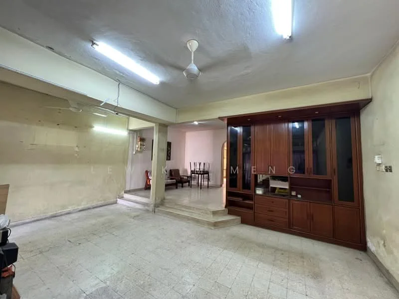 Room features: white painted walls, exposed ceiling, fluorescent lighting, ceiling fan, tiled flooring, built-in wooden cabinet, open layout, steps leading to another area; style: traditional.