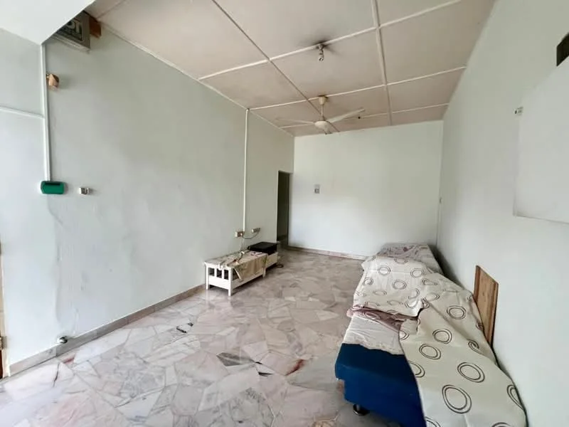 Living features: white painted walls, marble flooring, ceiling fan, two-seater sofa, single bed with bedding, coffee table, window, light fixture on ceiling.