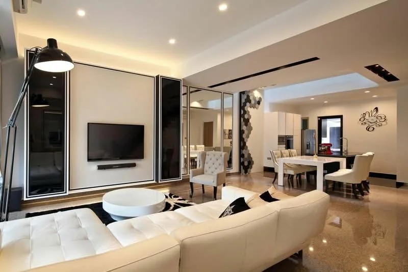 Living features: white leather sofa, round coffee table, wall-mounted TV, black accent wall, recessed downlights, polished concrete flooring, floor-to-ceiling windows, decorative wall paneling, ceiling-mounted air conditioning unit, dining area visible in background, white dining table with chairs; style: modern.