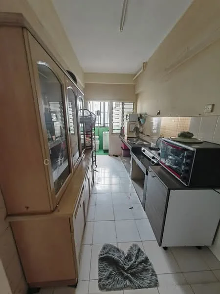 Kitchen features: white tiled flooring, cream painted walls, wooden cabinetry, glass display cabinet, stainless-steel sink, countertop with built-in stove, microwave oven, toaster, refrigerator, window with vertical blinds, open shelving, kitchen mat.