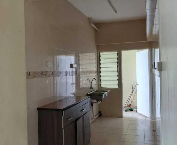 Kitchen features: white tiled walls, cream tiled backsplash, brown wooden cabinetry, single-bowl stainless-steel sink, chrome faucet, countertop with laminate finish, ceramic tile flooring, window with louvered shutters, door leading to outside, cleaning supplies visible.