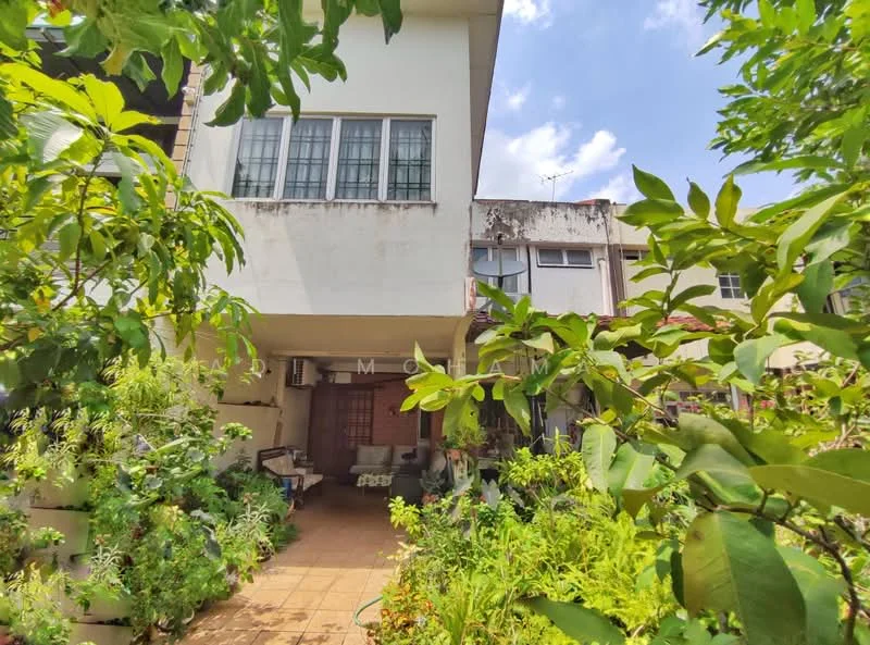 Exterior type: semi-detached house; features: two-storey structure, white painted facade, large windows with grid pattern, greenery surrounding the property, paved walkway, air conditioning units visible, garden area with various plants, partially shaded by trees, clear blue sky; style: modern.