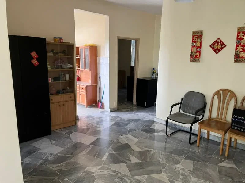 Room features: grey marble flooring, cream painted walls, wooden cabinet, glass-front display cabinet, two wooden chairs, one metal chair, doorway leading to another room, decorative wall hangings, open layout.