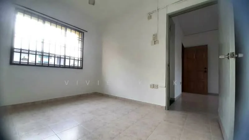 Room features: white painted walls, tile flooring, window with metal grille, light fixture on ceiling, doorway leading to another room, power outlets on walls, neutral color scheme; style: minimalist.