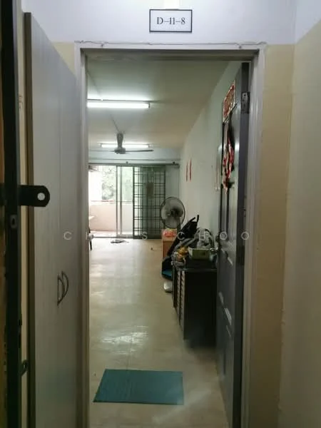 Room features: light-colored tiled flooring, white painted walls, ceiling lights, wall-mounted ceiling fan, open layout, doorway leading to another room, window with view to outside, furniture visible in the background.