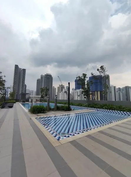 Exterior type: swimming pool deck; features: infinity pool, tiled pool deck with blue and white pattern, landscaped garden with greenery, surrounding high-rise buildings, urban skyline view, lounge seating area, paved walkway, water feature; style: modern.