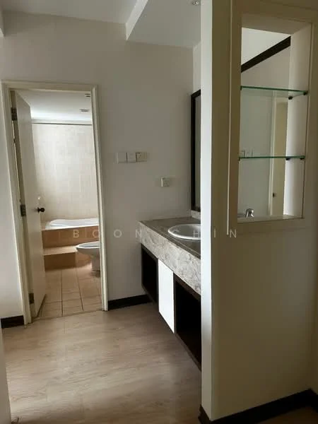 Bathroom features: single-sink vanity with stone countertop, mirror above vanity, light-colored tiled walls, bathtub visible in background, toilet visible in background, wooden flooring, glass shelf above vanity, white painted walls; style: modern.
