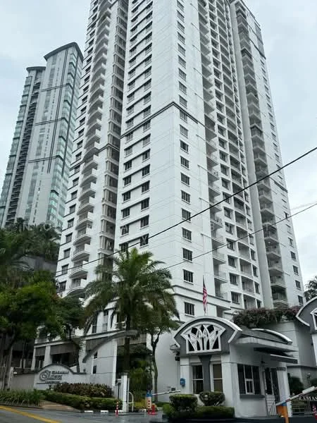 Exterior type: high-rise condominium; features: white painted facade, glass curtain wall, recessed balconies, approximately 20-storey high-rise, manicured landscaping, palm trees, entrance with awning, security guard house at entrance; style: modern.
